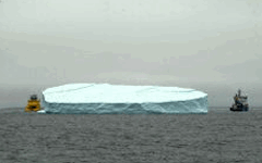 two ships towing iceberg