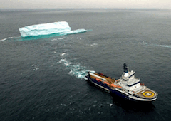 ship towing iceberg